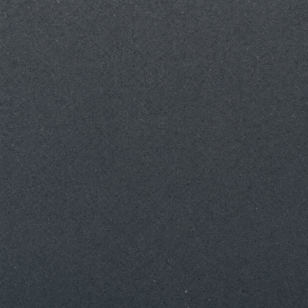 Honed black basalt stone pool coping in deep charcoal matte finish