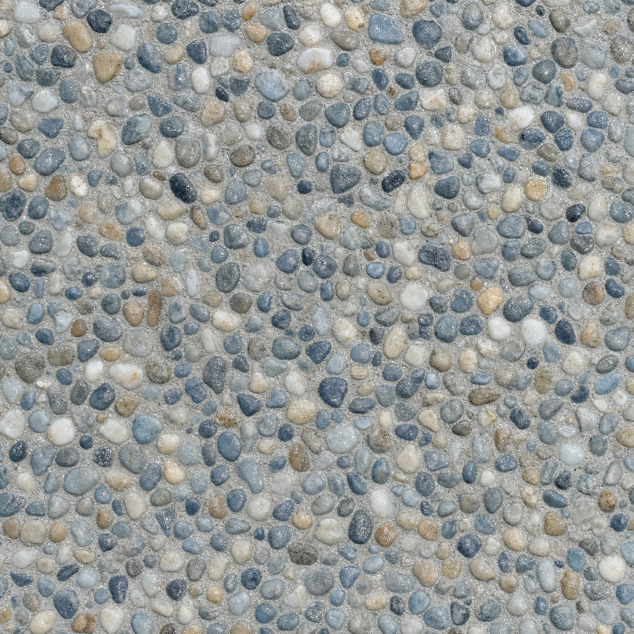 Premium pebble aggregate pool interior finish in blue-grey, white, and sand tones