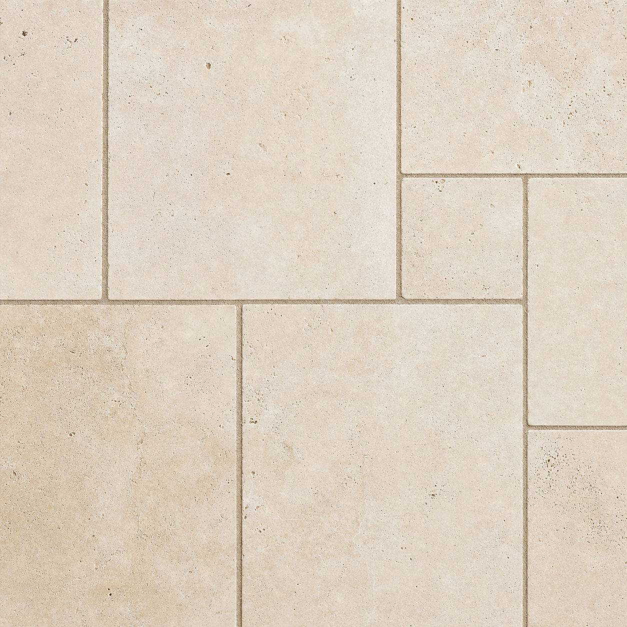 French-pattern travertine pavers in warm cream with natural pitting
